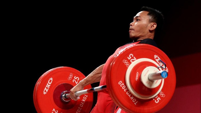 TOKYO, JAPAN - JULY 25: Eko Yuli Irawan of Team Indonesia competes during the Weightlifting - Mens 61kg Group A on day two of the Tokyo 2020 Olympic Games at Tokyo International Forum on July 25, 2021 in Tokyo, Japan. (Photo by Chris Graythen/Getty Images)
