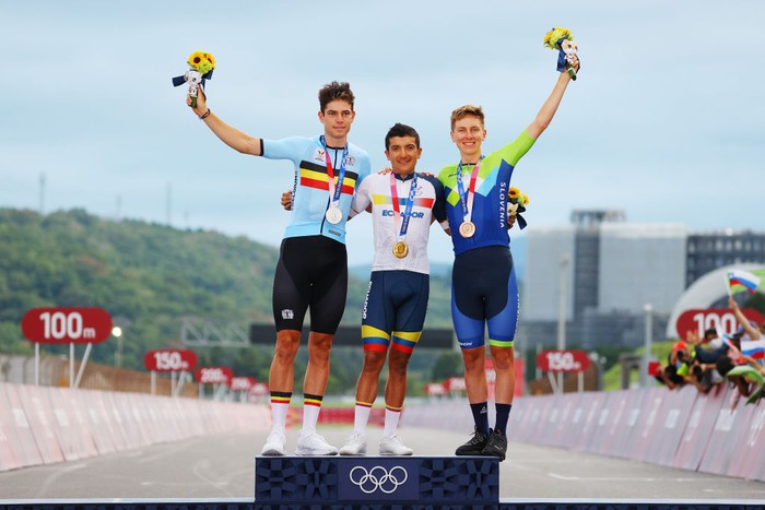 OYAMA, JAPAN - JULY 24: (L-R) Silver medalist Wout van Aert of Team Belgium, gold medalist Richard Carapaz of Team Ecuador, and bronze medalist Tadej Pogacar of Team Slovenia, pose on the podium during the medal ceremony during the Mens road race at the Fuji International Speedway on day one of the Tokyo 2020 Olympic Games on July 24, 2021 in Oyama, Shizuoka, Japan. (Photo by Tim de Waele/Getty Images)