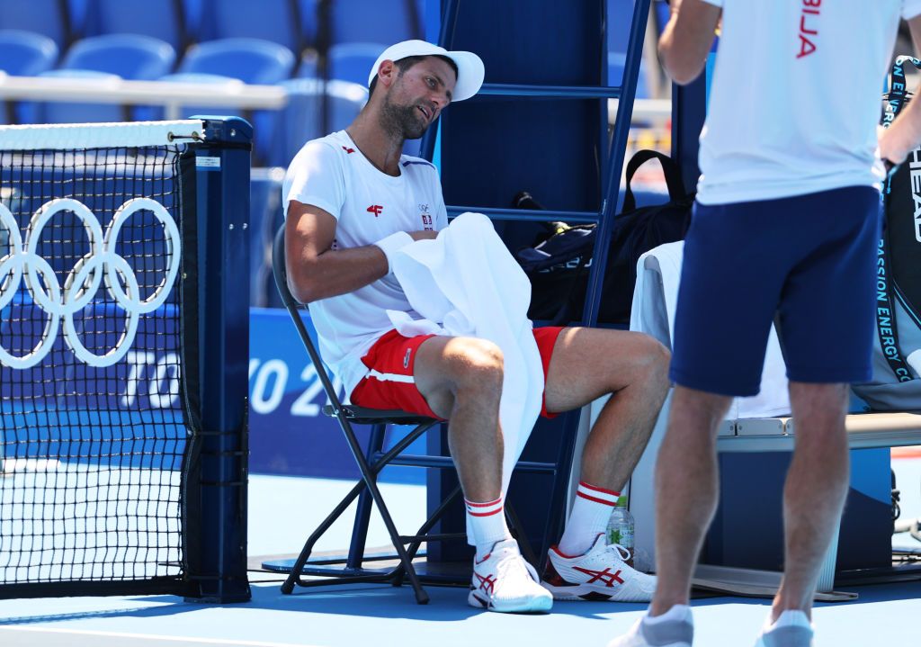 TOKYO, JAPAN - JULY 24: Novak Djokovic of Team Serbia plays a backhand during his Men's Singles First Round match against Hugo Dellien of Team Bolivia on day one of the Tokyo 2020 Olympic Games at Ariake Tennis Park on July 24, 2021 in Tokyo, Japan. (Photo by Clive Brunskill/Getty Images)