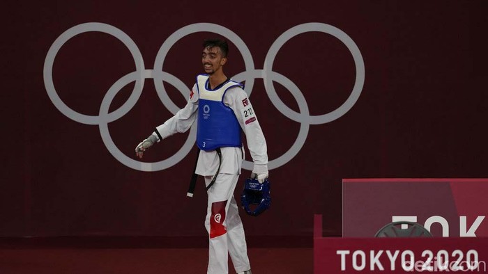 Tokyo Olympics Taekwondo Men Tunisia's Mohamed Khalil Jendoubi celebrates after defeating South Kore's Jang Jun to winning a gold medal during the men's 58kg taekwondo match at the 2020 Summer Olympics, Saturday, July 24, 2021, in Tokyo, Japan. (AP Photo/Themba Hadebe)