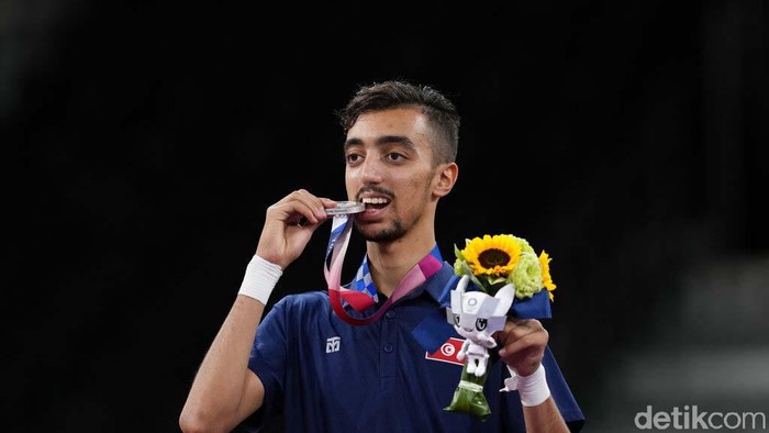 Tunisia's Mohamed Khalil Jendoubi celebrates after defeating South Kore's Jang Jun to winning a gold medal during the men's 58kg taekwondo match at the 2020 Summer Olympics, Saturday, July 24, 2021, in Tokyo, Japan. (AP Photo/Themba Hadebe)