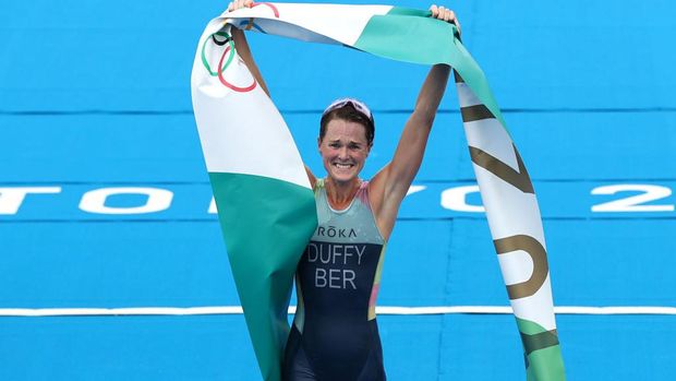 TOKYO, JAPAN - JULY 27:  Flora Duffy of Team Bermuda celebrates winning the gold medal during the Women's Individual Triathlon on day four of the Tokyo 2020 Olympic Games at Odaiba Marine Park on July 27, 2021 in Tokyo, Japan. (Photo by Cameron Spencer/Getty Images)
