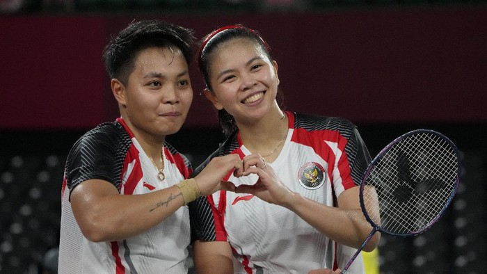 Indonesias Greysia Polii and Rahayu Apriani celebrate after winning against Japans Yuki Fukushima and Sayaka Hirota during their womens doubles group play stage badminton match at the 2020 Summer Olympics, Tuesday, July 27, 2021, in Tokyo, Japan. (AP Photo/Markus Schreiber)