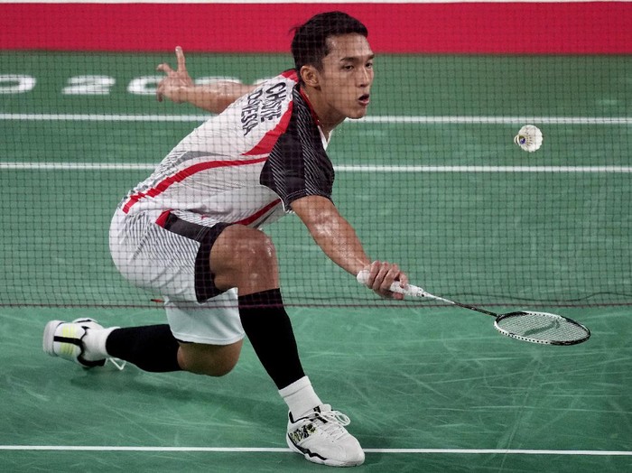 Jonatan Christie of Indonesia competes against Singapores Kean Yew Loh during mens singles group play stage Badminton match at the 2020 Summer Olympics, Wednesday, July 28, 2021, in Tokyo, Japan. (AP Photo/Dita Alangkara)