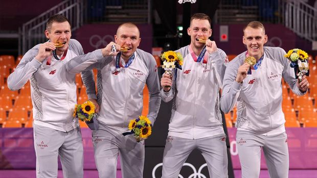 TOKYO, JAPAN - JULY 28: Gold medalists Nauris Miezis, Karlis Lasmanis, Edgars Krumins and Agnis Cavars of Team Latvia pose with their gold medals for the 3x3 Basketball competition on day five of the Tokyo 2020 Olympic Games at Aomi Urban Sports Park on July 28, 2021 in Tokyo, Japan. (Photo by Christian Petersen/Getty Images)