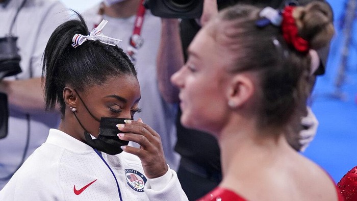 Simone Biles, of the United States, waits to perform on the vault during the artistic gymnastics womens final at the 2020 Summer Olympics, Tuesday, July 27, 2021, in Tokyo. The American gymnastics superstar has withdrawn the all-around competition to focus on her mental well-being. (AP Photo/Gregory Bull)