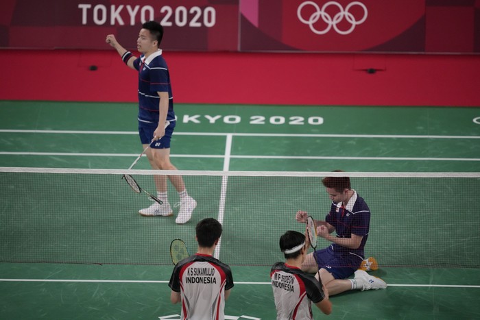 Malaysias Aaron Chia and Soh Wooi Yik celebrate after defeating Indonesias Marcus Fernaldi Gideon and Kevin Sanjaya Sukamuljo during their mens doubles quarterfinal match at the 2020 Summer Olympics, Thursday, July 29, 2021, in Tokyo, Japan. (AP Photo/Dita Alangkara)