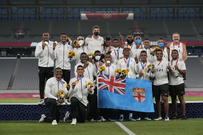Fijis team poses with their gold medals after winning mens rugby sevens at the 2020 Summer Olympics, Wednesday, July 28, 2021 in Tokyo, Japan. (AP Photo/Shuji Kajiyama)