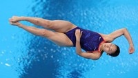 Ekspresi tidak biasa atlet lompat indah tuan rumah Jepang Haruka Enomoto (Maddie Meyer/Getty Images).