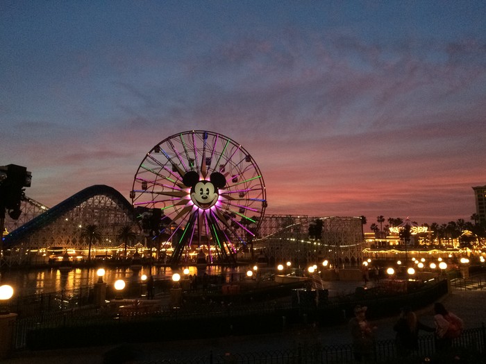 Anahiem, California, USA - December 21, 2014: Tourists wander around Disneys California Adventure at dusk. California Adventure is a park located adjacent to Disneyland, a major tourist attraction in Anaheim.