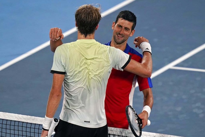 Novak Djokovic, of Serbia, reacts after being defeated by Alexander Zverev, of Germany, during a semifinals match of the tennis competition at the 2020 Summer Olympics, Friday, July 30, 2021, in Tokyo, Japan. (AP Photo/Seth Wenig)
