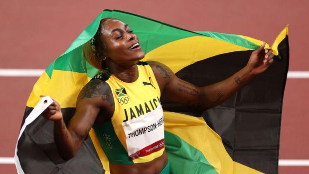 TOKYO, JAPAN - JULY 31: Elaine Thompson-Herah of Team Jamaica celebrates after winning the gold medal in the Women's 100m Final on day eight of the Tokyo 2020 Olympic Games at Olympic Stadium on July 31, 2021 in Tokyo, Japan. (Photo by David Ramos/Getty Images)