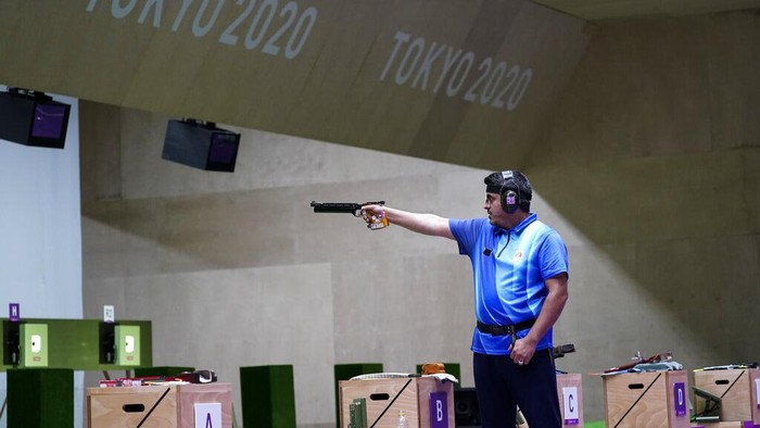 Javad Foroughi, of Iran, competes in the mens 10-meter air pistol at the Asaka Shooting Range in the 2020 Summer Olympics, Saturday, July 24, 2021, in Tokyo, Japan. Foroughi went on to win the gold medal. (AP Photo/Alex Brandon)