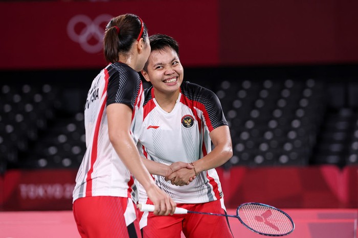 CHOFU, JAPAN - JULY 31: Greysia Polii(right) and Apriyani Rahayu of Team Indonesia celebrate after their victory against Lee Sohee and Shin Seungchan of Team South Korea during a Women’s Doubles Semi-final match on day eight of the Tokyo 2020 Olympic Games at Musashino Forest Sport Plaza on July 31, 2021 in Chofu, Tokyo, Japan. (Photo by Lintao Zhang/Getty Images)