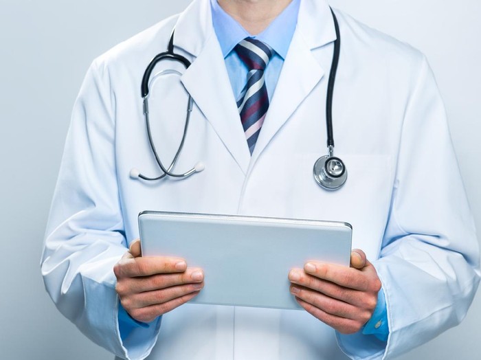 Doctor using a digital tablet. Technology and medicine concept