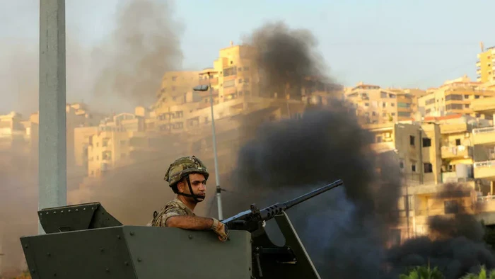 Military checkpoints backed by armoured vehicles were erected at various road crossings leading to Khalde (ANWAR AMRO/AFP)