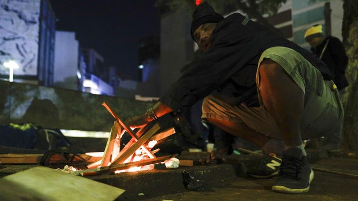 Homeless people sleep on mattresses laid out by the government inside a subway station amid historically cold weather in Sao Paulo, Brazil, early Friday, July 30, 2021. The Brazilian government's meteorological institute says low temperatures should endure until the start of August. (AP Photo/Marcelo Chello)