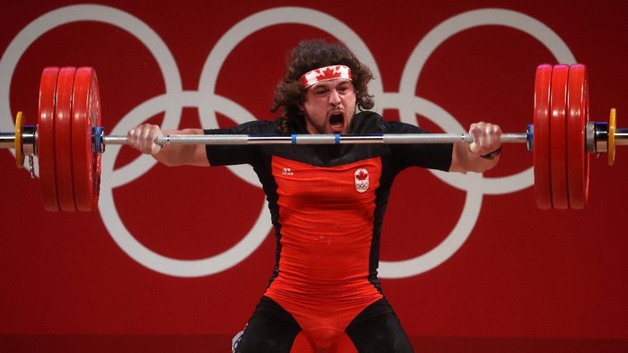 TOKYO, JAPAN - JULY 31: Boady Robert Santavy of Team Canada competes during the Weightlifting - Mens 96kg Group A on day eight of the Tokyo 2020 Olympic Games at Tokyo International Forum on July 31, 2021 in Tokyo, Japan. (Photo by Chris Graythen/Getty Images)