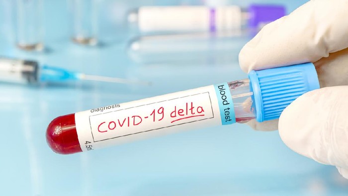 Doctor with a positive blood sample for the new variant detected of the coronavirus strain called covid DELTA. Research of new strains and mutations of the Covid 19 coronavirus in the laboratory