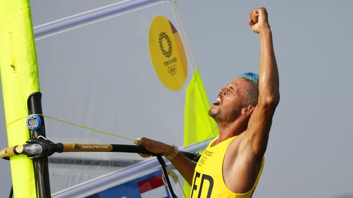 Kiran Badloe Kiran Badloe, from The Netherlands, celebrates after placing first in the men's windsurfer medal race at the 2020 Summer Olympics, Saturday, July 31, 2021, in Fujisawa, Japan. (AP Photo/Bernat Armangue)