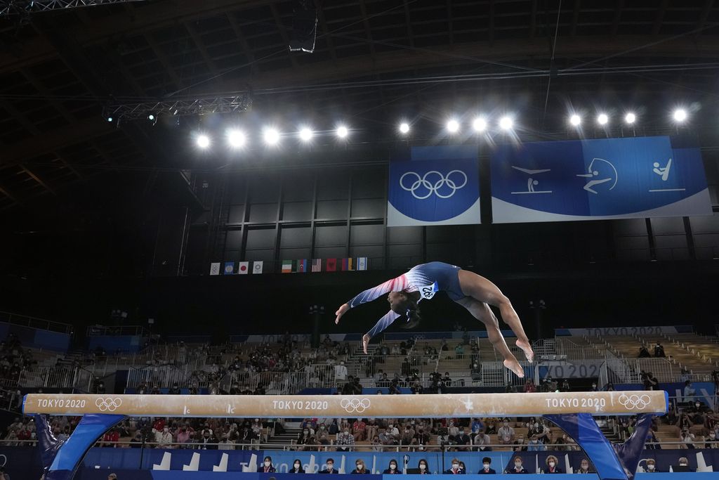 Simone Biles, of the United States, performs on the balance beam during the artistic gymnastics women's apparatus final at the 2020 Summer Olympics, Tuesday, Aug. 3, 2021, in Tokyo, Japan. (AP Photo/Gregory Bull)