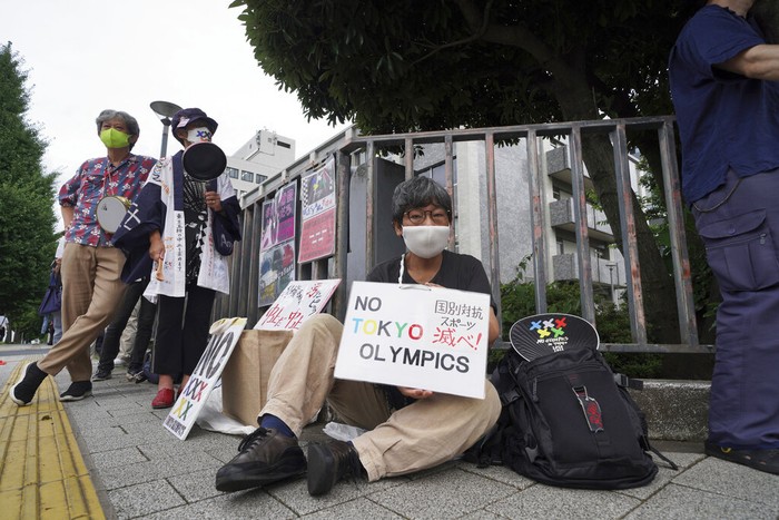 Tokyo Olympics Protest Protesters demonstrate in front of the Prime Minister's Office in Tokyo, Japan, Monday, Aug. 2, 2021. They were protesting against the Olympics and Paralympics held during the pandemic as Japan has expanded a coronavirus state of emergency to Tokyo's neighboring prefectures in addition to the capital, following recent record spikes in infections. (AP Photo/Kantaro Komiya)