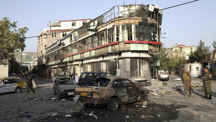 Afghan security personnel stand guard following an attack in Kabul, Afghanistan, Wednesday, Aug. 4, 2021. A powerful explosion rocked an upscale neighborhood of Afghanistans capital Tuesday in an attack that apparently targeted the countrys acting defense minister. (AP Photo/Rahmat Gul)
