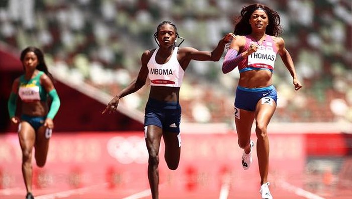 TOKYO, JAPAN - AUGUST 02: Christine Mboma of Team Namibia and Gabrielle Thomas of Team United States compete in round one of the Women's 200m heats on day ten of the Tokyo 2020 Olympic Games at Olympic Stadium on August 02, 2021 in Tokyo, Japan. (Photo by Ryan Pierse/Getty Images)