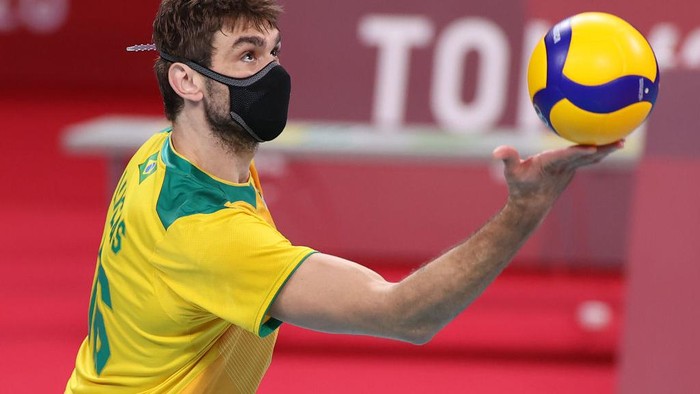 TOKYO, JAPAN - AUGUST 03: Lucas Saatkamp #16 of Team Brazil hits the ball against Team Japan during the Mens Quarterfinals volleyball on day eleven of the Tokyo 2020 Olympic Games at Ariake Arena on August 03, 2021 in Tokyo, Japan. (Photo by Toru Hanai/Getty Images)