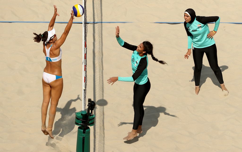 RIO DE JANEIRO, BRAZIL - AUGUST 09: Laura Giombini of Italy and Nada Meawad of Egypt battle at the net during the Women's Beach Volleyball Preliminary Pool A match on Day 4 of the Rio 2016 Olympic Games at the Beach Volleyball Arena on August 9, 2016 in Rio de Janeiro, Brazil.  (Photo by Ezra Shaw/Getty Images)