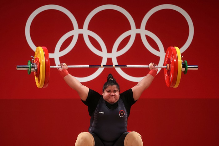 TOKYO, JAPAN - AUGUST 02: Nurul Akmal of Team Indonesia competes during the Weightlifting - Women's 87kg+ Group A on day ten of the Tokyo 2020 Olympic Games at Tokyo International Forum on August 02, 2021 in Tokyo, Japan. (Photo by Chris Graythen/Getty Images)