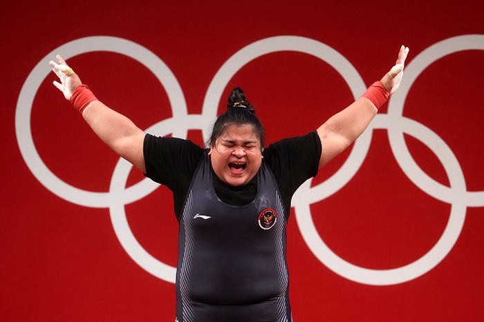 TOKYO, JAPAN - AUGUST 02: Nurul Akmal of Team Indonesia competes during the Weightlifting - Women's 87kg+ Group A on day ten of the Tokyo 2020 Olympic Games at Tokyo International Forum on August 02, 2021 in Tokyo, Japan. (Photo by Chris Graythen/Getty Images)