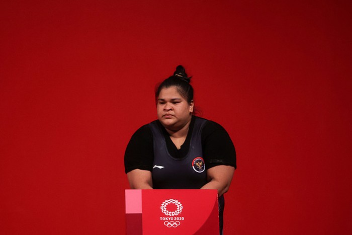 1331936423 TOKYO, JAPAN - AUGUST 02: Nurul Akmal of Team Indonesia competes during the Weightlifting - Women's 87kg+ Group A on day ten of the Tokyo 2020 Olympic Games at Tokyo International Forum on August 02, 2021 in Tokyo, Japan. (Photo by Chris Graythen/Getty Images)