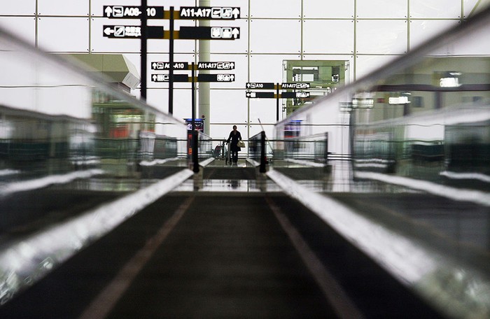 WUHAN, CHINA - APRIL 13: (CHINA OUT) A worker walks on the conveyor belt for passengers in the No. 2 Terminal Building of Wuhan Tianhe Airport on April 13, 2008 in Wuhan of Hubei Province, China. The new No. 2 Terminal Building of Tianhe Airport, which is due to open on April 15, 2008 has a annual passenger handling capacity of 13 million and a cargo handling capacity of 320,000 tons. Its 20 boarding bridges can berth 11 Boeing 737s, eight Boeing 767s and 1 A380 Airbus at the same time. (Photo by China Photos/Getty Images)