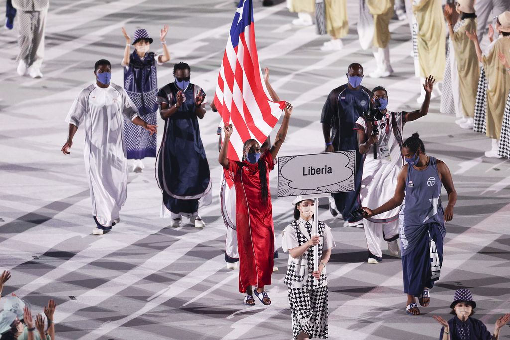 TOKYO, JAPAN - JULY 23: Flag bearers Ebony Morrison and Joseph Fahnbulleh of Team Liberia during the Opening Ceremony of the Tokyo 2020 Olympic Games at Olympic Stadium on July 23, 2021 in Tokyo, Japan. (Photo by Patrick Smith/Getty Images)