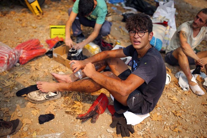 Turkey Wildfires Turkish volunteers rest as they fight wildfires in Turgut village, near tourist resort of Marmaris, Mugla, Turkey, Wednesday, Aug. 4, 2021. As Turkish fire crews pressed ahead Tuesday with their weeklong battle against blazes tearing through forests and villages on the country's southern coast, President Recep Tayyip Erdogan's government faced increased criticism over its apparent poor response and inadequate preparedness for large-scale wildfires.(AP Photo/Emre Tazegul)