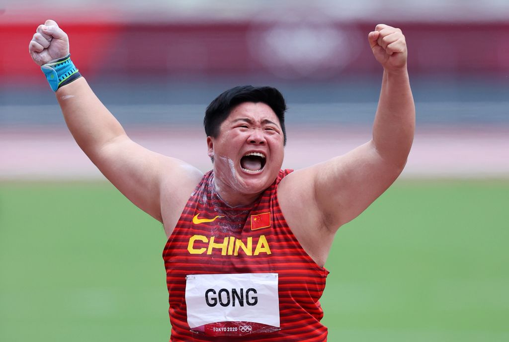 TOKYO, JAPAN - AUGUST 01: Lijiao Gong of Team China celebrates with the gold medal during the medal ceremony for the Women's Shot Put on day nine of the Tokyo 2020 Olympic Games at Olympic Stadium on August 01, 2021 in Tokyo, Japan. (Photo by Ryan Pierse/Getty Images)