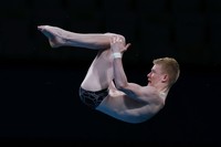 TOKYO, JAPAN - AUGUST 06: Jaden Shiloh Eikermann Gregorchuk of Team Germany competes in the Mens 10m Platform preliminaries on day fourteen of the Tokyo 2020 Olympic Games at Tokyo Aquatics Centre on August 06, 2021 in Tokyo, Japan. (Photo by Al Bello/Getty Images)