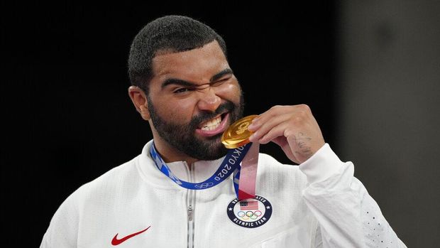 United State's Gable Dan Steveson celebrates with his gold medal during the victory ceremony for men's freestyle 125kg wrestling at the 2020 Summer Olympics, Friday, Aug. 6, 2021, in Chiba, Japan. (AP Photo/Aaron Favila)