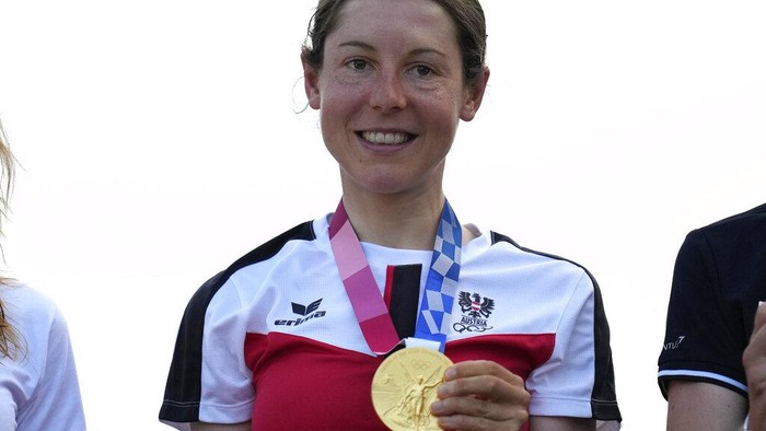 Tokyo Olympics Cycling Anna Kiesenhofer of Austria holds her gold medal during a medal ceremony for the womens cycling road race at the 2020 Summer Olympics, Sunday, July 25, 2021, in Oyama, Japan. (AP Photo/Christophe Ena)