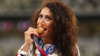 Italia melengkapi posisi 10 besar dengan perolehan 10 emas 10 perak dan 20 perunggu. AP Photo/Martin Meissner. 