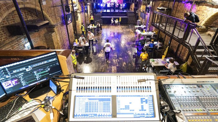 Drag queen Baga Chips, real name Leo Loren, receives a Pfizer vaccine shot at a pop-up Covid vaccination centre, set up at Heaven night club in London, Sunday, Aug. 8, 2021. London's Heaven club has become the UK's first nightclub to be turned into a pop-up Coronavirus vaccination centre, as authorities try to attract younger people to get vaccinated. (AP Photo/Alberto Pezzali)
