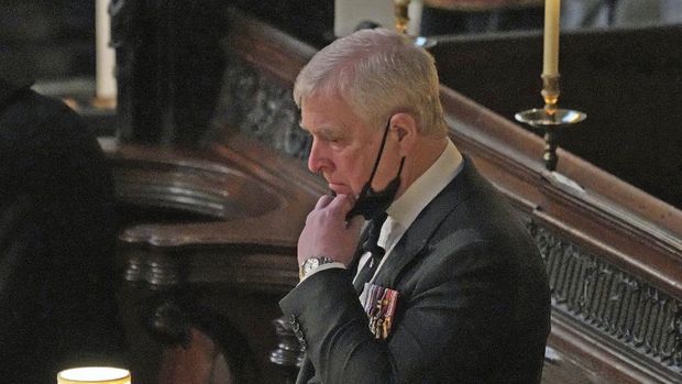 FILE - Britain's Prince Andrew stands inside St. George's Chapel during the funeral of his father, Prince Philip, at Windsor Castle, Windsor, England, Saturday April 17, 2021. Longtime Jeffrey Epstein accuser Virginia Giuffre sued Prince Andrew on Monday, Aug. 9, 2021, saying he sexually assaulted her when she was 17. Lawyers for Giuffre filed the lawsuit in Manhattan federal court. (Yui Mok/Pool via AP, File)