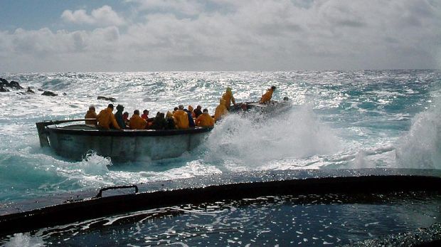 A longboat is seen being launch in rough seas in this June 13, 2003  photo at Bounty Bay, Pitcairn Island. The spotlight will soon shine on the existance of its 47 remaining inhabitants when seven islander men stand trial on a string of sex abuse charges.  (AP Photo)