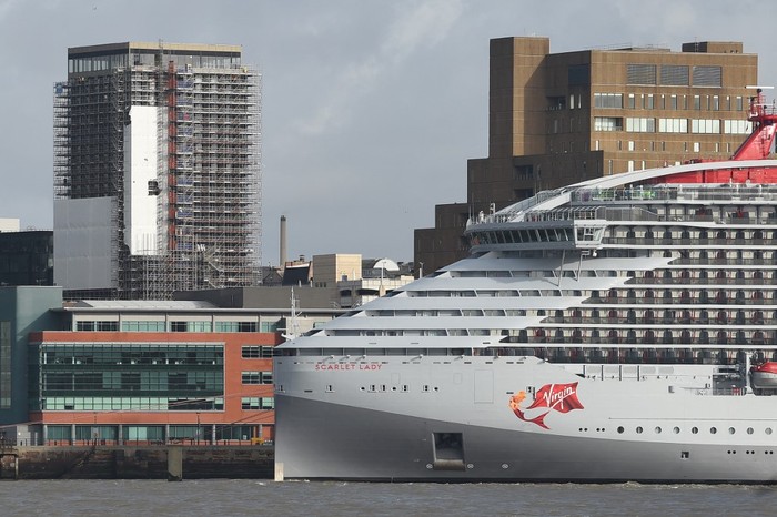The Virgin Voyages cruise ship Scarlet Lady is seen on the River Mersey in Liverpool on February 26, 2020. - Sailing from its intended home port of Miami, Florida, Scarlet Lady is Virgin Voyages first luxury cruise ship and is set to start operating from April 2020 on routes from Florida around the Carribean. (Photo by Paul ELLIS / AFP)