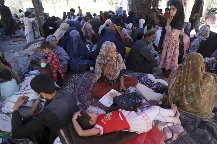 Internally displaced Afghans from northern provinces, who fled their home due to fighting between the Taliban and Afghan security personnel, wait to receive free food in a public park in Kabul, Afghanistan, Tuesday, Aug. 10, 2021. (AP Photo/Rahmat Gul)