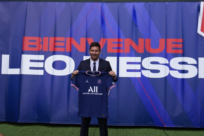 Lionel Messi Lionel Messi holds his jersey after a press conference Wednesday, Aug. 11, 2021 at the Parc des Princes stadium in Paris. Lionel Messi said hes been enjoying his time in Paris since the first minute after he signed his Paris Saint-Germain contract on Tuesday night. The 34-year-old Argentina star signed a two-year deal with the option for a third season after leaving Barcelona. (AP Photo/Francois Mori)