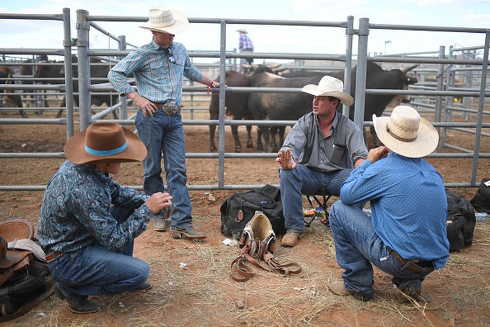 1333897391 MOUNT ISA, AUSTRALIA - AUGUST 13: Spectators watch events at the Mount Isa Mines Rodeo on August 13, 2021 in Mount Isa, Australia. Established in 1959, the Mount Isa Rodeo is the richest in the southern hemisphere and attracts contestants from all parts of the world. (Photo by Dan Peled/Getty Images)