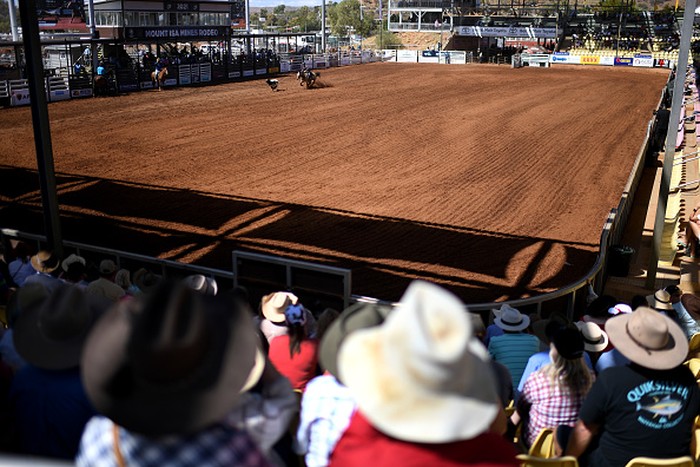1333897391 MOUNT ISA, AUSTRALIA - AUGUST 13: Spectators watch events at the Mount Isa Mines Rodeo on August 13, 2021 in Mount Isa, Australia. Established in 1959, the Mount Isa Rodeo is the richest in the southern hemisphere and attracts contestants from all parts of the world. (Photo by Dan Peled/Getty Images)