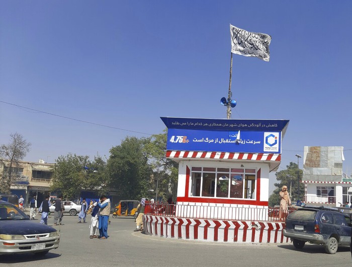 APTOPIX Afghanistan A Taliban flag flies in the main square of Kunduz city after fighting between Taliban and Afghan security forces, in Kunduz, Afghanistan, Sunday, Aug. 8, 2021. Taliban fighters Sunday took control of much of the capital of northern Afghanistan's Kunduz province, including the governor's office and police headquarters, a provincial council member said. (AP Photo/Abdullah Sahil)